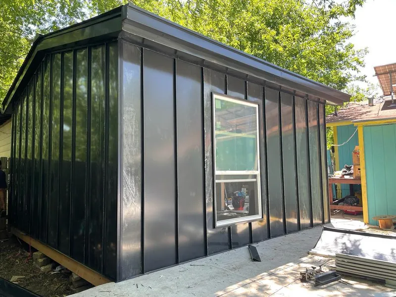 Black standing seam metal wall panels for Roof Inspection in Leon Valley