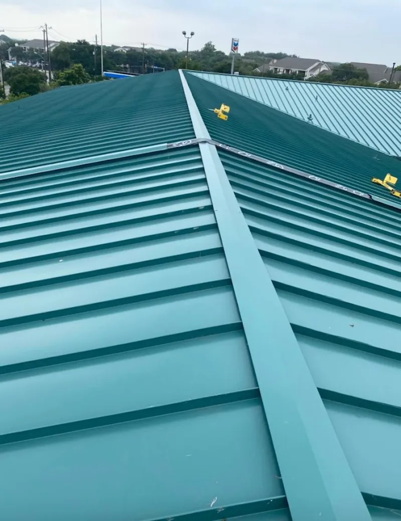 Green commercial metal roof ridge and valley for Metal Roof Repair in Leon Valley